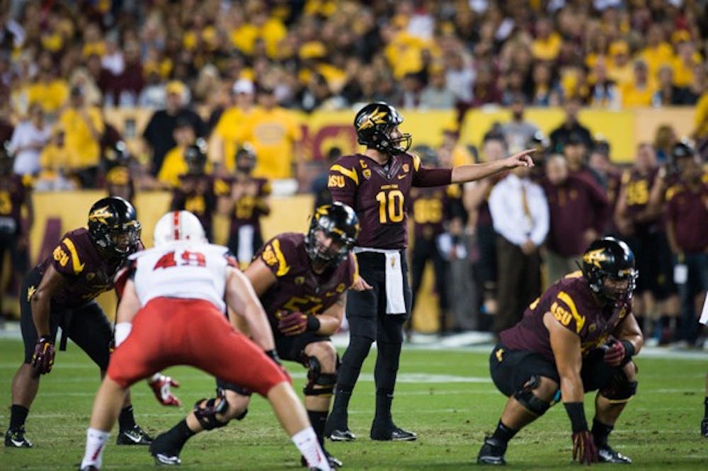 Redshirt senior quarterback Taylor Kelly directs ASU's offense in the Sun Devil's 19-16 OT win over Utah. (Photo by Andrew Ybanez)