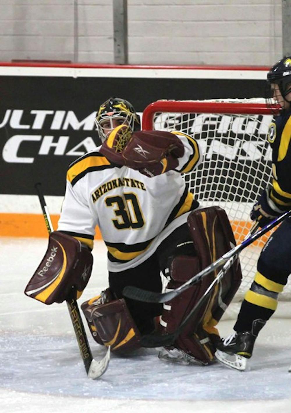 ASU senior goaltender Mark Shacker makes a glove save during the Sun Devils’ game against Central Oklahoma on Oct. 29. The No. 4 ASU squad swept No. 6 Ohio with the help of some great play by Shacker. (Photo by Lisa Bartoli)