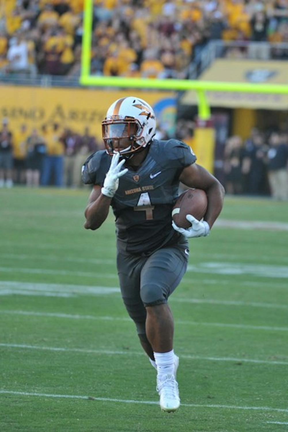 Freshman running back Demario Richard carries the ball on Nov. 8, 2014 against Notre Dame. ASU defeated Notre Dame 55-31 at Sun Devil Stadium. (Photo by Andrew Ybanez)