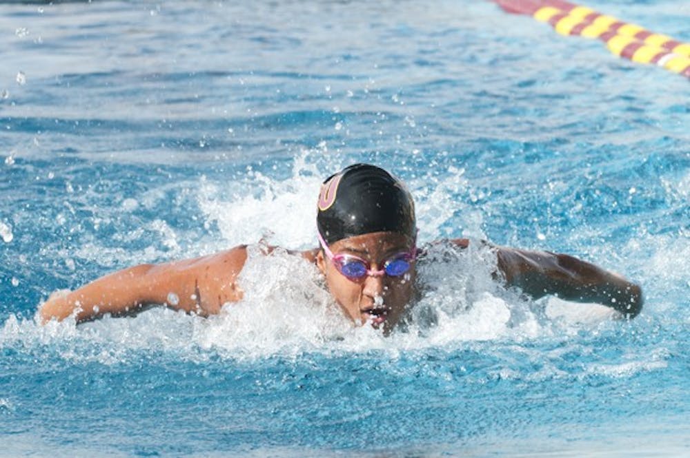 Miriam Crispo swims the 100 fly at a Feb. 2 meet against NAU. The swim and dive squad __ (Photo by Molly J. Smith)