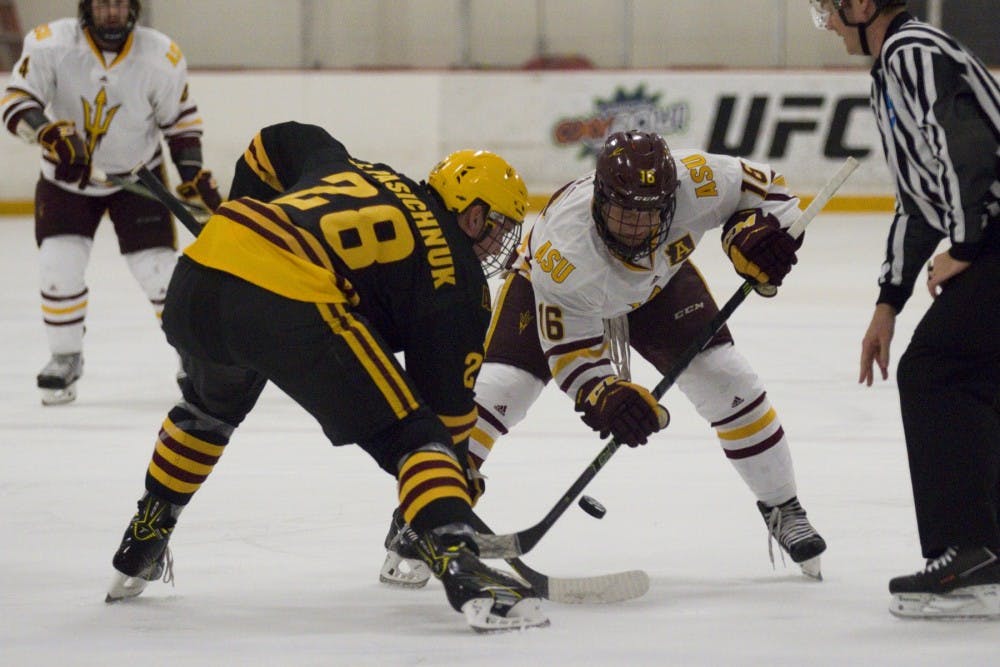 ASU freshman center Steenn Pasichnuk (28, gold) goes for a faceoff versus ASU senior center and assistant captain Ryan Belonger (16, maroon) in the annual Maroon and Gold Scrimmage at Oceanside Ice Arena, in Tempe, Arizona on Saturday, Oct. 1, 2016. The maroon team won 4-3 in overtime.
