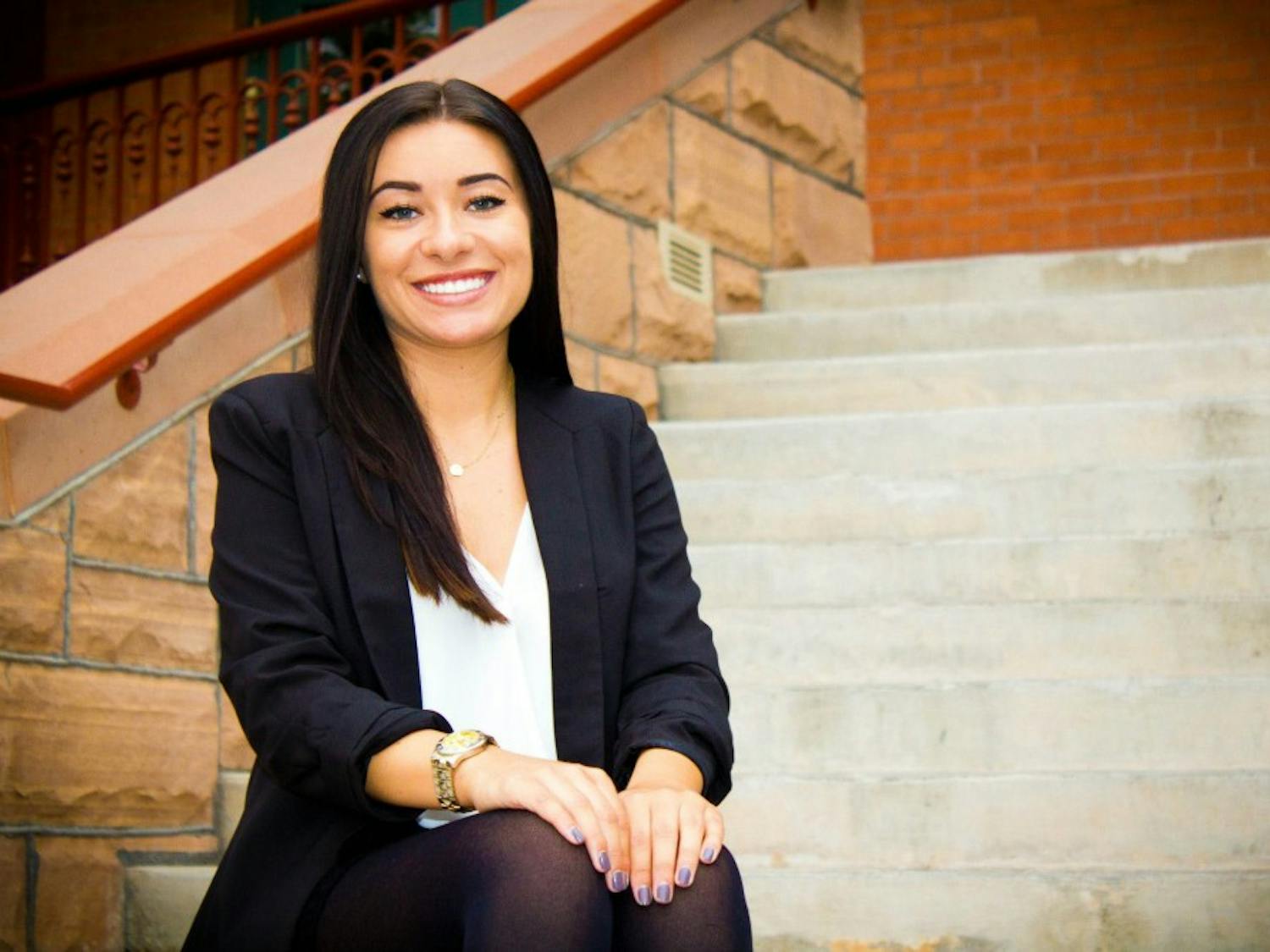 Justice Studies junior Caitlan Rocha poses for a portrait on the steps of Old Main on the ASU Tempe campus.