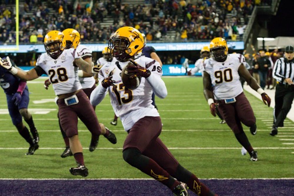 Freshman defensive back Armand Perry carries an interception for a touchdown during the 4th quarter of the game against Washington on Oct. 25. ASU defeated Washington 24-10. (Photo by Andrew Ybanez)