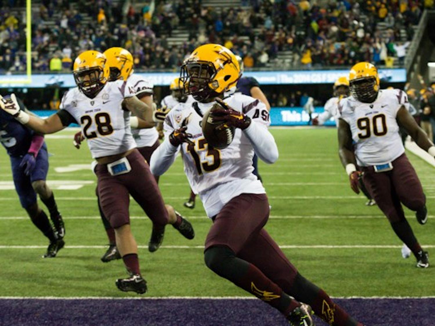 Freshman defensive back Armand Perry carries an interception for a touchdown during the 4th quarter of the game against Washington on Oct. 25. ASU defeated Washington 24-10. (Photo by Andrew Ybanez)