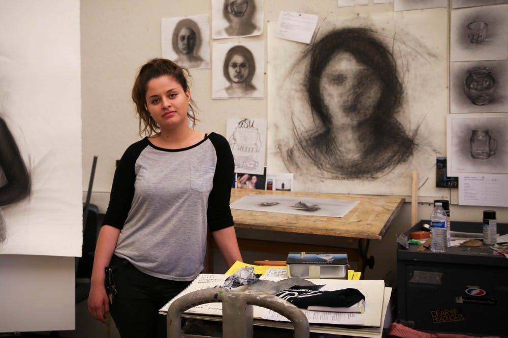 ASU senior Azalea Rodriguez, double major in drawing and photography, poses with her artwork,w which will be featured in the upcoming Sonders exhibiton.