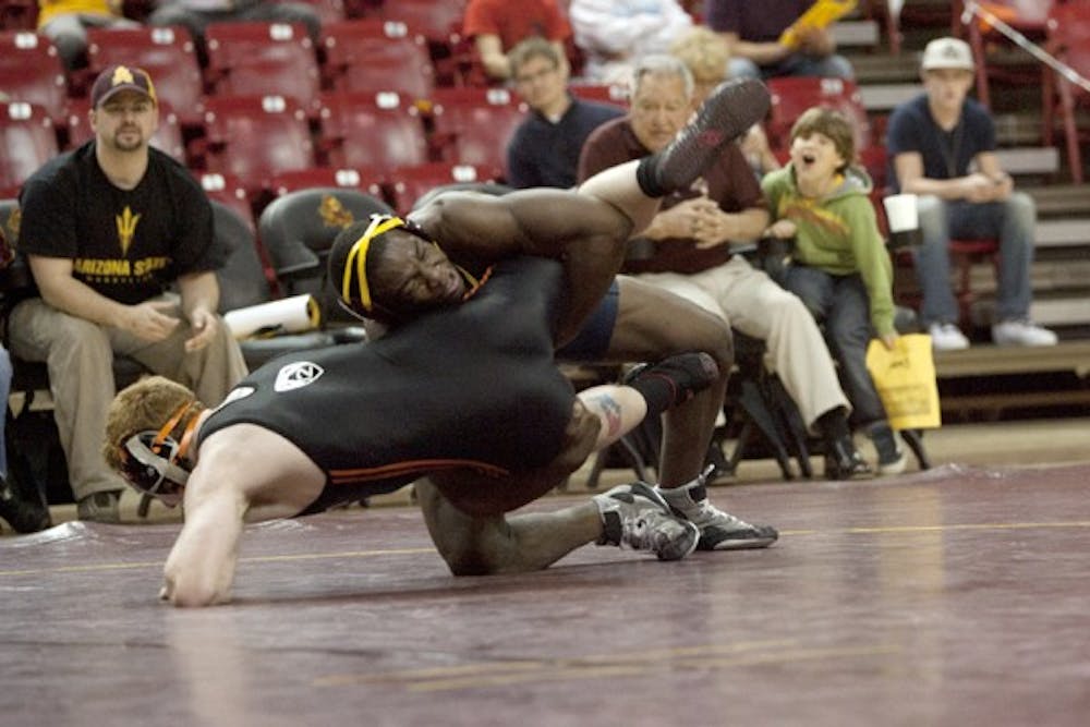 Kevin Radford takes down an opponent in a meet against Oregon State on Jan. 8. The Sun Devils look to snap a seven-match losing streak when they visit Cal Poly. (Photo courtesy of Tom Story)