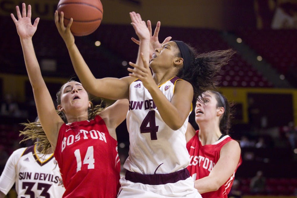 ASU freshman guard Kiara Russell (4) goes up for a tough layup in traffic during the second half of a women's basketball game against the Boston University Terriers in Wells Fargo Arena in Tempe, Arizona on Saturday, Dec. 3, 2016. ASU won 71-42, putting them at 4-2 on the season.