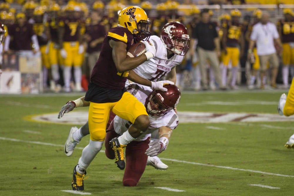 ASU redshirt senior wide receiver Tim White (12) stiff-arms a WSU player during a kick return in the second half of a 37-32 loss to WSU in Sun Devil Stadium in Tempe, Arizona, on Saturday, Oct. 22, 2016.
