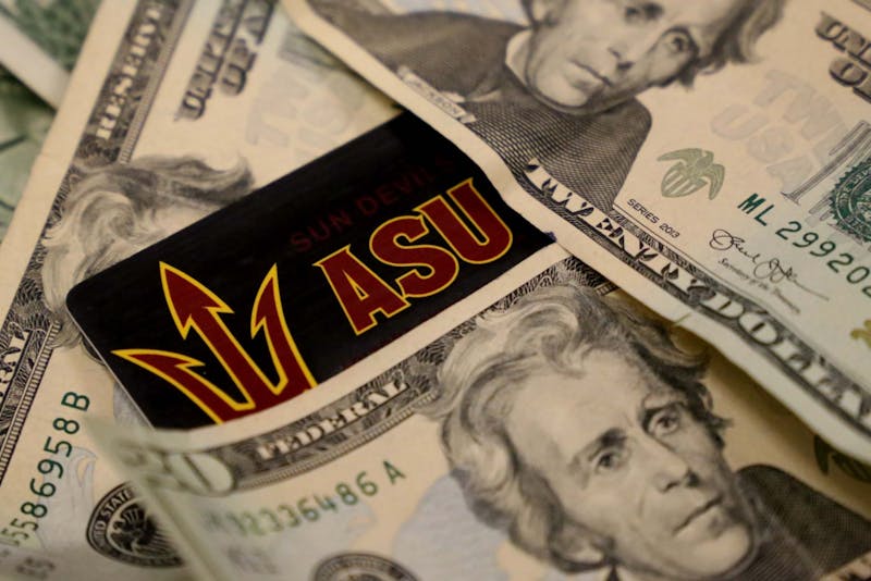 Money photographed around an ASU I.D. card on Monday, March 14, 2016. ASU Chief Financial Officer Morgan Olsen addressed multiple topics surrounding the University's finances in a meeting with The State Press on March 11.