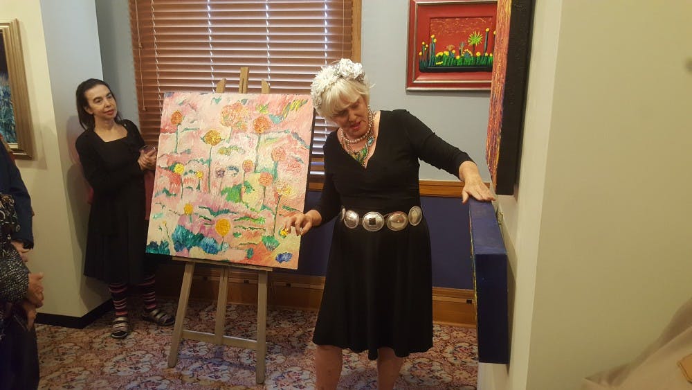 Patsy "Skyline" Lowry discusses her art at her "Arizona Spirits" gallery in the State Senate Museum in Phoenix, Arizona.