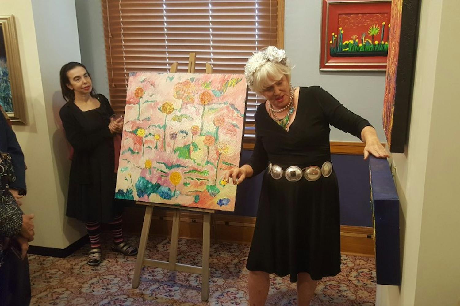 Patsy "Skyline" Lowry discusses her art at her "Arizona Spirits" gallery in the State Senate Museum in Phoenix, Arizona.
