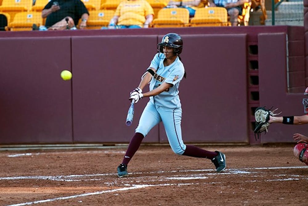 Senior outfielder Alix Johnson makes contact with the ball at a home game against Utah on April 11. The Sun Devils won 4-3. (Photo by Mario Mendez)