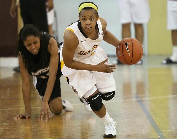 FULL COURT FOCUS: ASU redshirt senior guard Dymond Simon dribbles away from a fallen Providence player during Friday's 63-36 ASU win. The Sun Devils fell in Saturday's game to No. 14 Florida State, but Simon was named to the Junkanoo Jam All-Tournament Team. (Photo Courtesy of Steve Rodriguez)