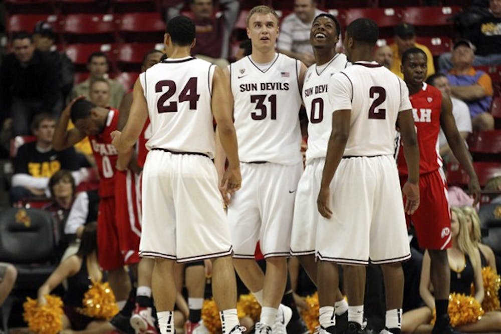 (Left to right) Trent Lockett, Jonathan Gilling, Carrick Felix and Chris Colvin huddle together in a game against Utah on Feb. 9. The Sun Devils lost to the Washington Huskies on Thursday night. (Photo by Sam Rosenbaum)