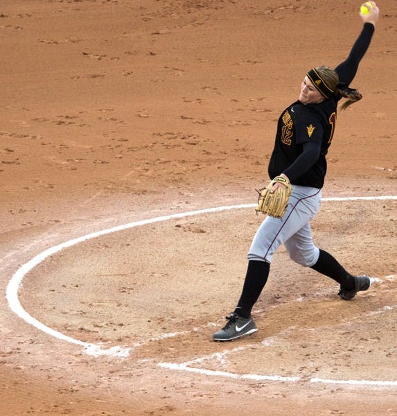 Junior pitcher Dallas Escobedo winds back ready to release a pitch against Kentucky on Feb. 9. Escobedo and the ASU softball pitching staff have led the Sun Devils to a 7-0 start. (Photo by Dominic Valente)