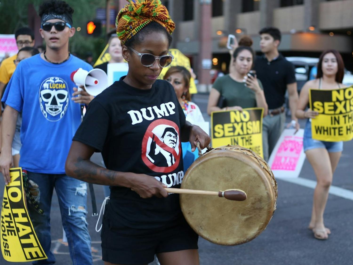 A protestor marches around downtown Phoenix during a Trump rally on Wednesday, Aug. 31, 2016. 