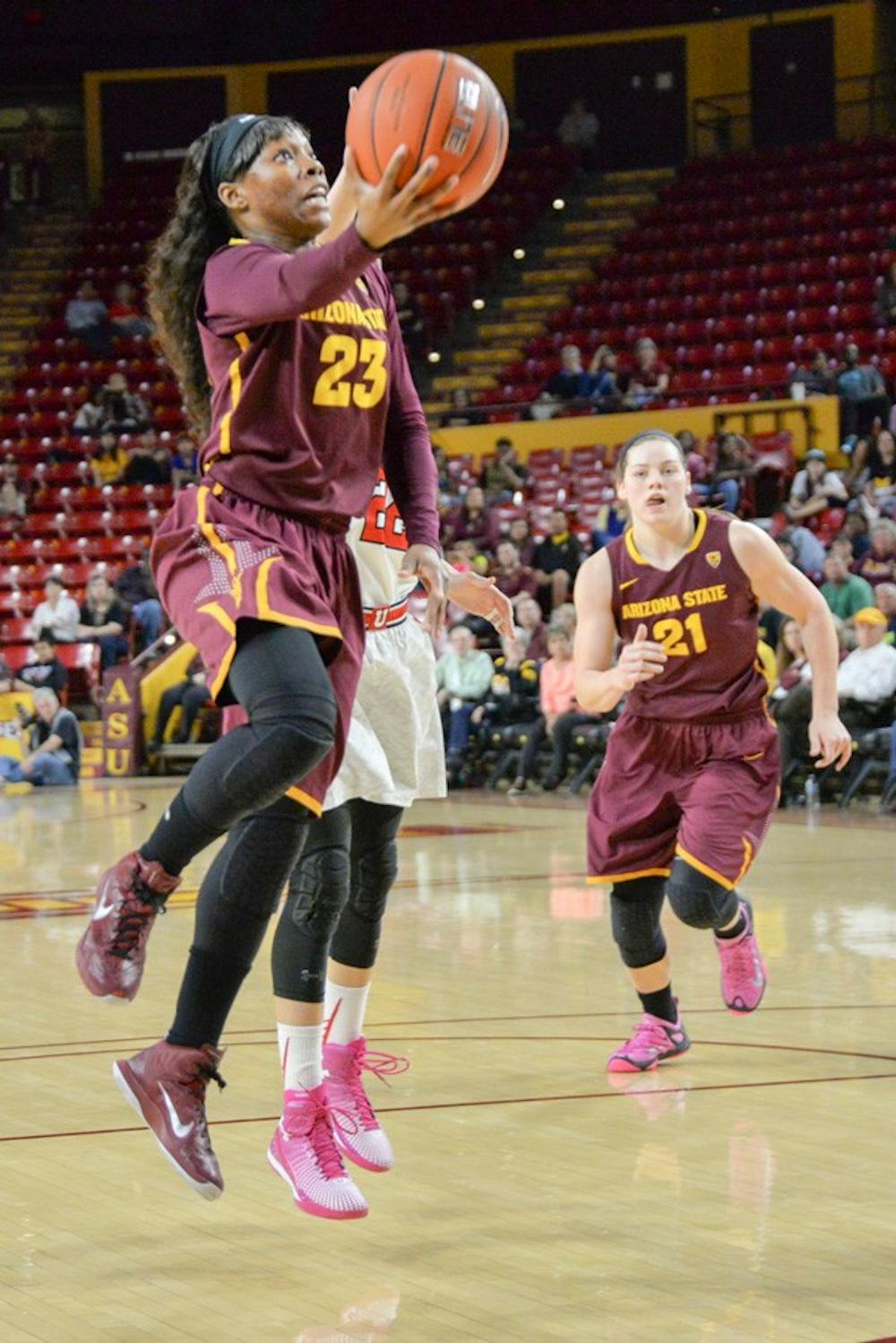 Junior Elisha Davis takes to the air for two points Friday night against Utah. The Sun Devils would go on to win the game 45-42 over the Utes on Feb. 27, 2015 at the Wells Fargo Arena in Tempe. (J. Bauer-Leffler/The State Press)