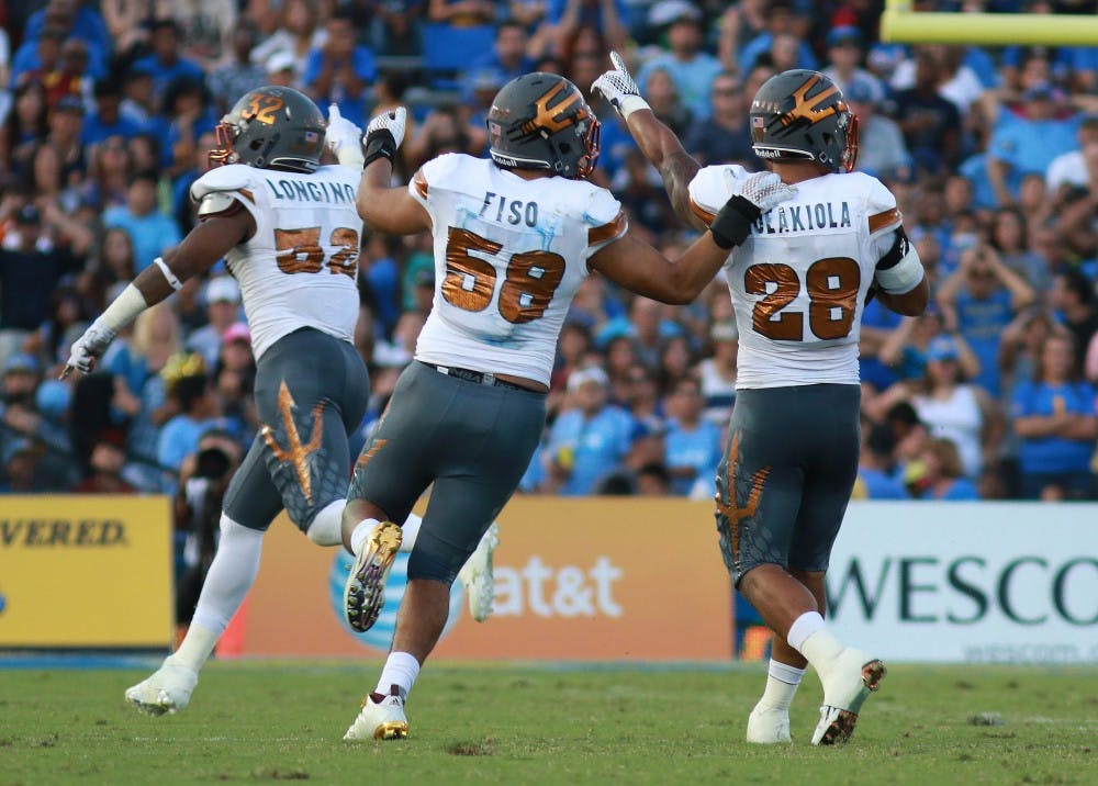 Redshirt junior linebacker Viliami “Laiu” Moeakiola (28) reacts with redshirt junior linebacker Salamo Fiso (58) after a change in possession in the second quarter against UCLA on Saturday, Oct. 3, 2015, at Rose Bowl in Pasadena, California. The Sun Devils lead 15-10 over the Bruins at half. 