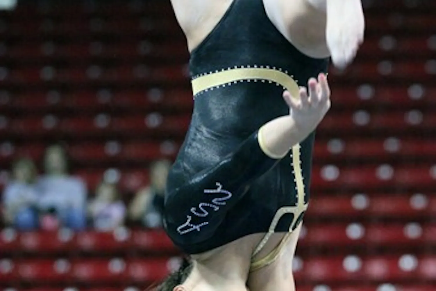 Natelle Gentile performs a beam routine in a meet against Illinois on Feb. 19. Gentile set her season-high score with a 9.825 against Washington. (Photo by Beth Easterbrook)
