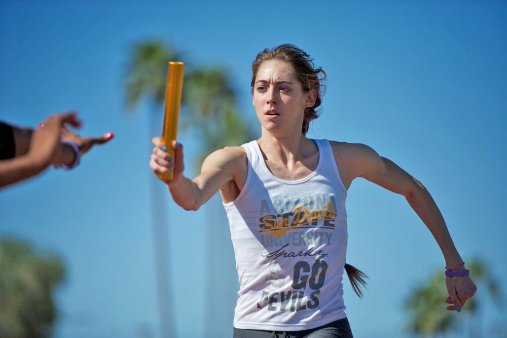 Fresh start: ASU freshman Sarah Geren works on relay handoffs during a practice in Tempe on March 9. The Sun Devils opened the outdoor track season with the Baldy Castillo Invitational this past weekend. (Photo by Michael Arellano)