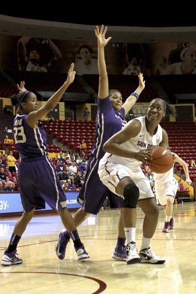 Redshirt senior Janae Fulcher goes up strong for a shot in the block against Washington on Feb. 3. Fulcher has been the only consistent scorer averaging 11.6 points per game. (Photo by Sam Rosenbaum)