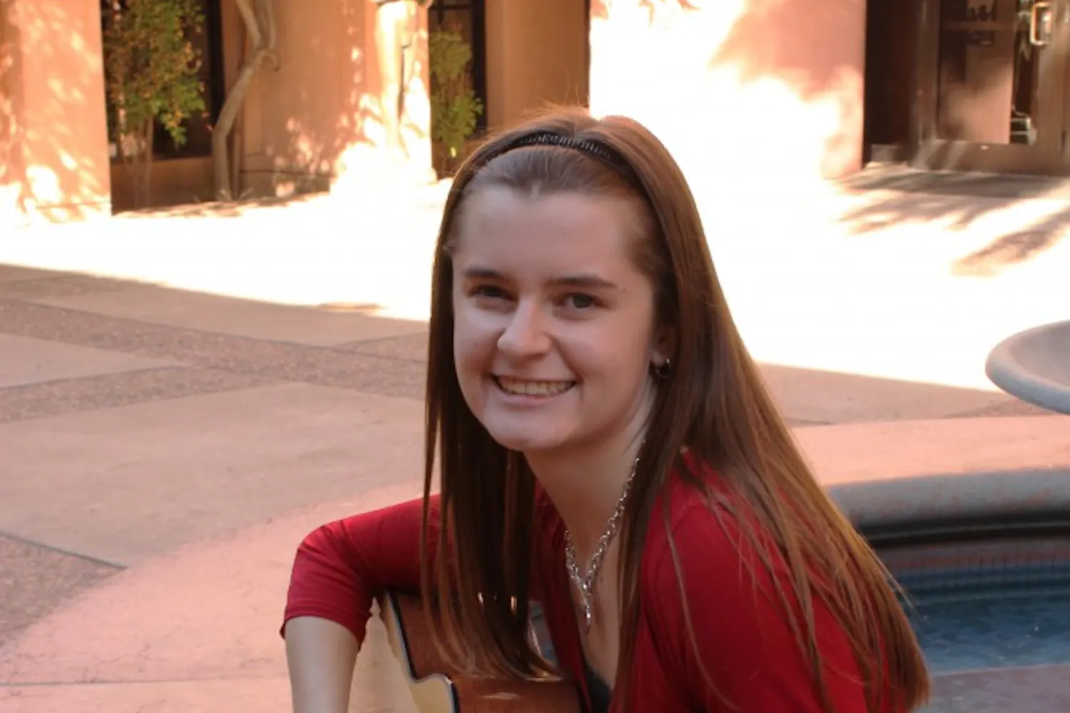 Shelbe Olson, music therapy major and sophomore, practices her guitar in the music building at ASU. Olson, along with other music therapy majors, are required to learn the basics of guitar and other musical instruments for their field of study. (Photo by Laura Davis)