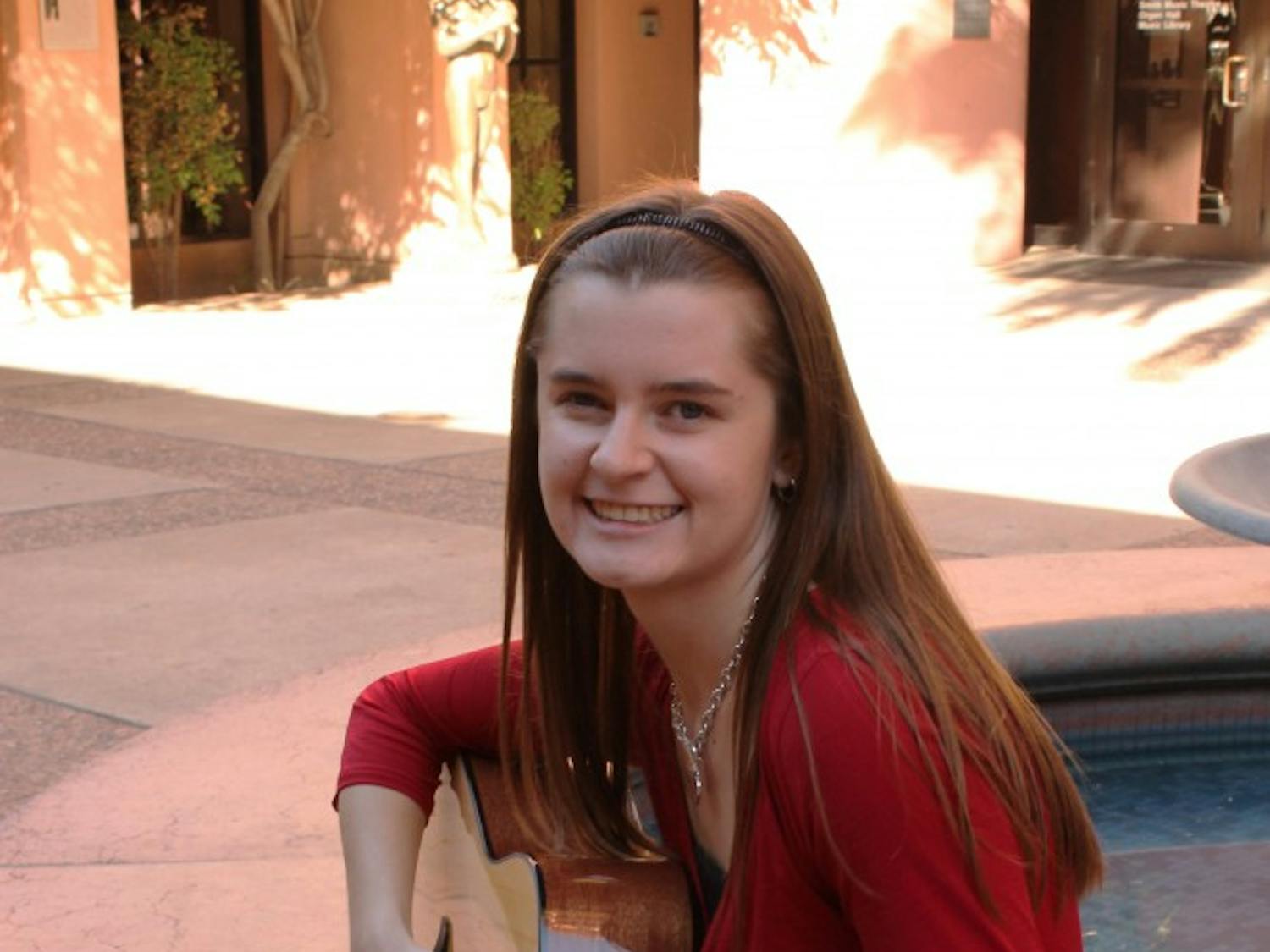 Shelbe Olson, music therapy major and sophomore, practices her guitar in the music building at ASU. Olson, along with other music therapy majors, are required to learn the basics of guitar and other musical instruments for their field of study. (Photo by Laura Davis)