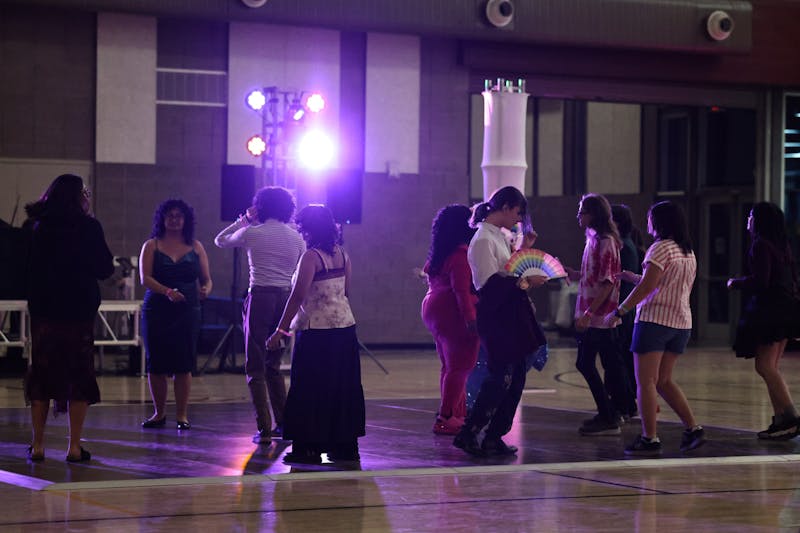 Students dance on the dance floor on Friday, April 10, 2026 at Rainbow Royale at the SDFC in Mesa.