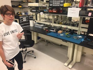 Sarah Rogers points to equipment that is&nbsp;used to test software for the CubeSat in a lab on ASU's Tempe campus&nbsp;on March 3, 2017.
