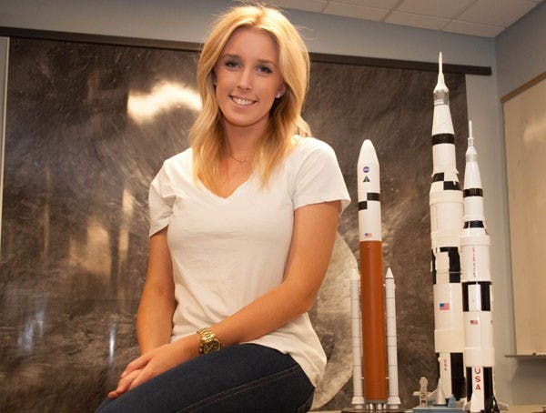 Business communication senior Laura Fisher poses in the Lunar Reconnaissance Orbiter Camera Science Operation Center at ASU's Tempe campus Friday. Fisher recently returned from a summer internship at NASA's Jet Propulsion Laboratory in Pasadena, Calif. (Photo by Danielle Gregory)