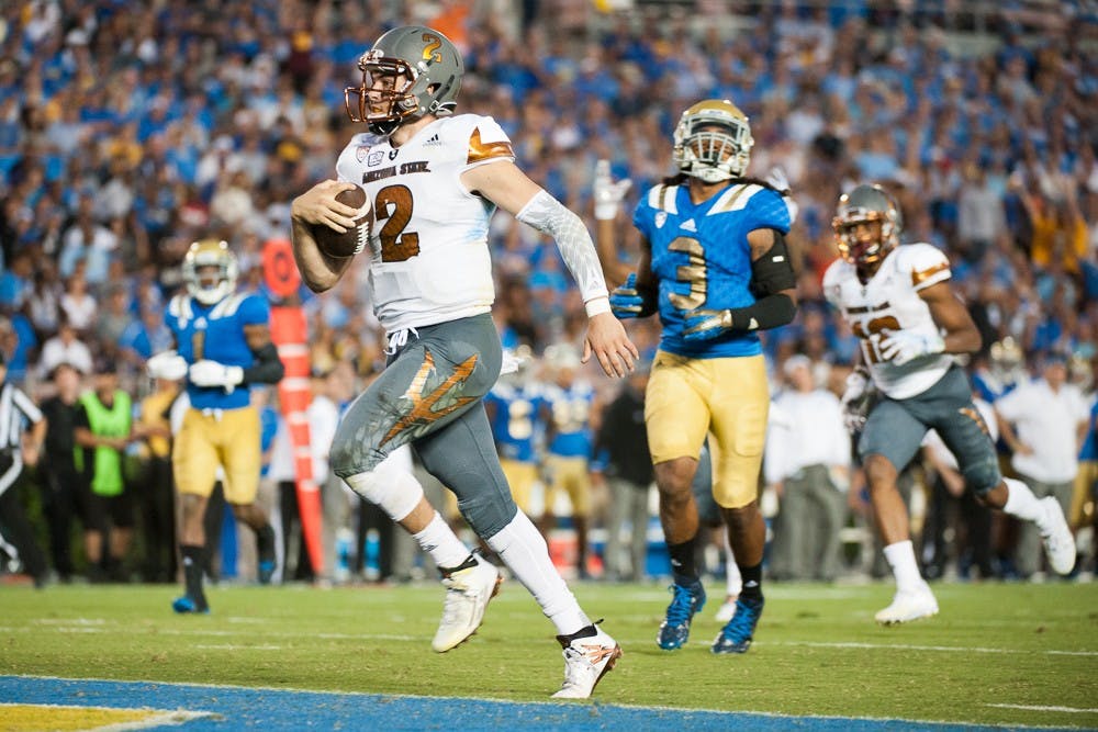 Redshirt senior quarterback Mike Bercovici runs for a touchdown against UCLA on Saturday, Oct. 3, 2015, at Rose Bowl Stadium in Pasadena, Calif. The Sun Devils defeated the Bruins 38-23.