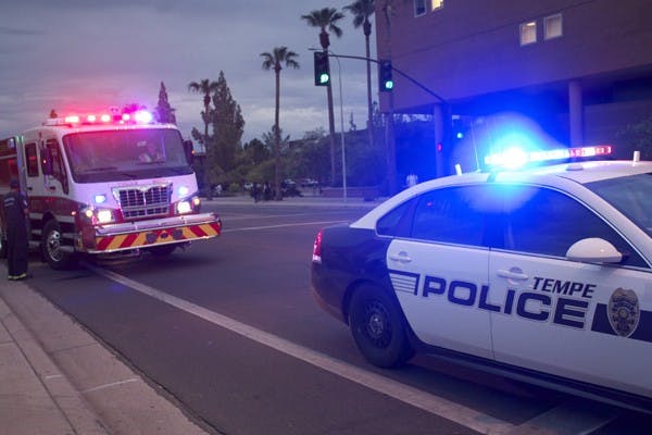 FAST RESPONSE: Tempe police and fire departments responded to a minor collision involving two students on University Drive outside of San Pablo Hall on Monday evening. (Photo by Shawn Raymundo