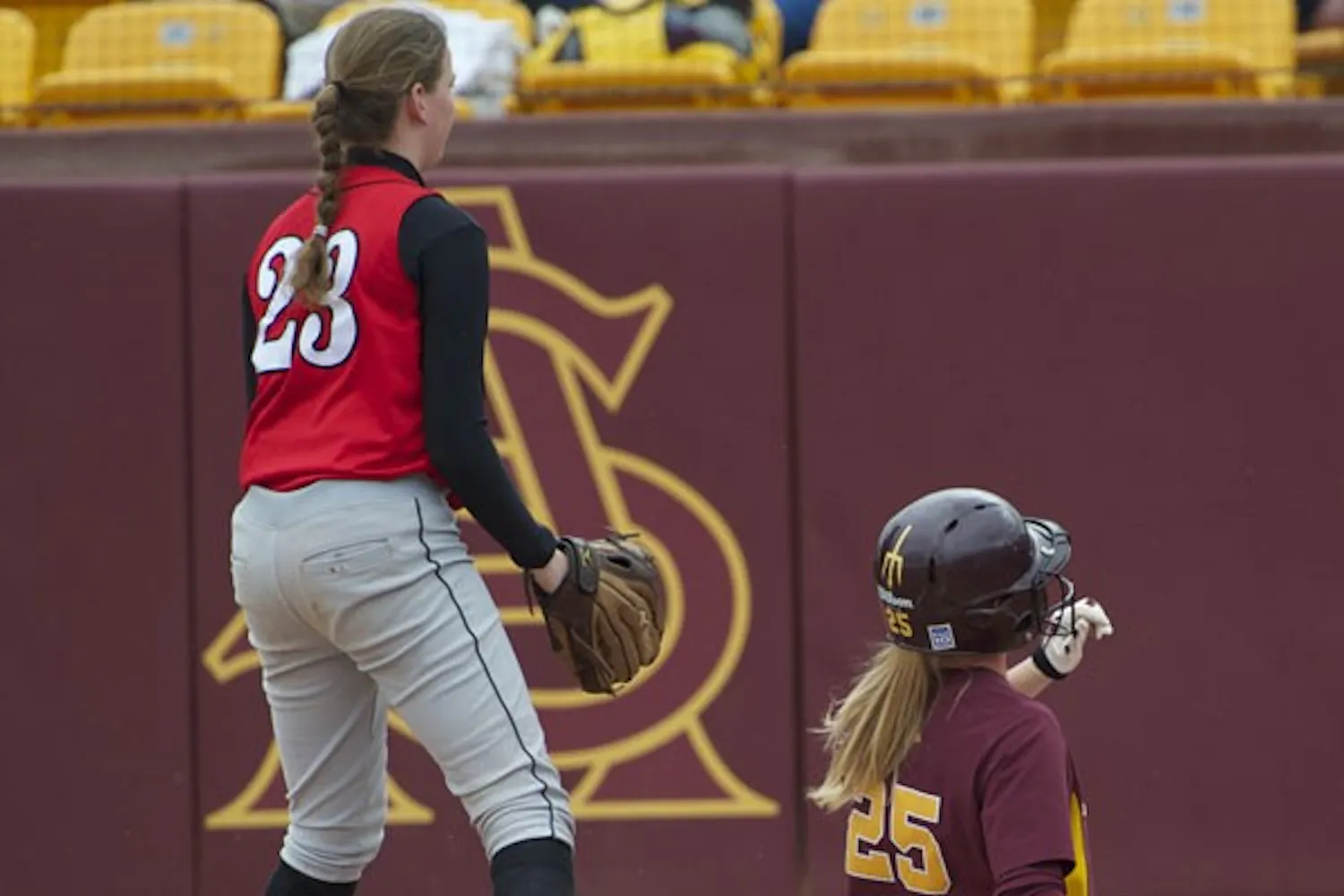 SHE'S SAFE: ASU junior catcher Lacy Goodman slides across home plate in the Sun Devils’ win against Rutgers last month. The Sun Devils swept Cal Poly over the weekend. (Photo by Michael Arellano)