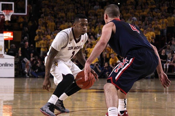 Sophomore guard Jahii Carson looks to make his next move against UA defense at a home game on Feb. 14, 2014. ASU won against UA 69-66. (Photo by Alexis Macklin)