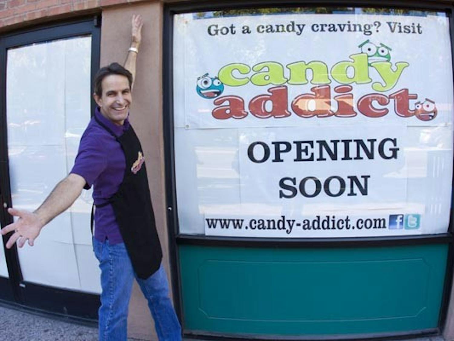 I WANT CANDY: Frank Ellis stands in front of his candy emporium, Candy Addict, on Mill Avenue. The interior is going through renovations, but Ellis is eager to open up shop in mid-December. (Photo by Annie Wechter)