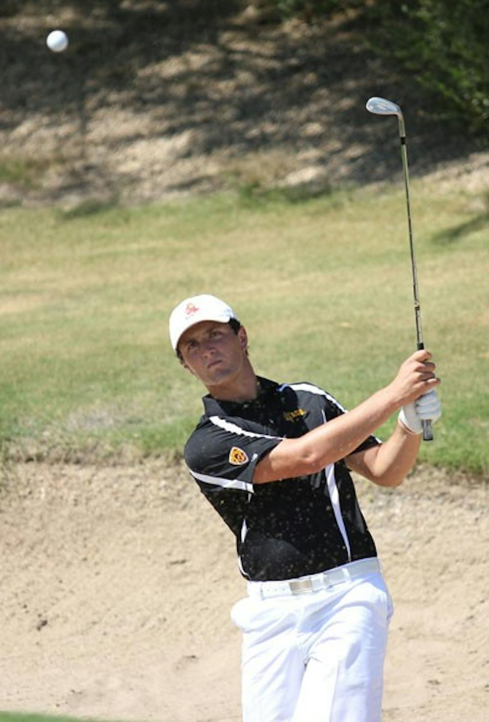 Junior Jon Rahm launches the ball out of a sand trap during an ASU golf practice on Sept. 21, 2012 prior to the Pac-12 Preview in Oregon. (Photo by Kyle Newman)