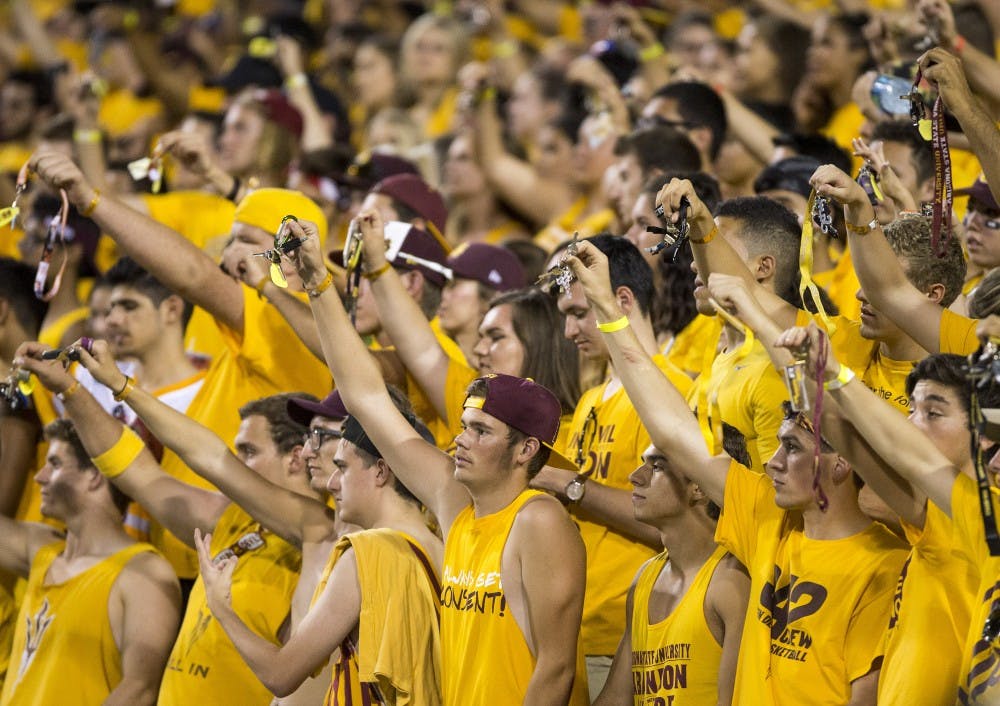 Students in the Inferno section wave their keys during a game against visiting Cal Poly at Sun Devil Stadium in Tempe on Saturday, Sept. 12, 2015. ASU beat Cal Poly 35-21 in their season opener. 