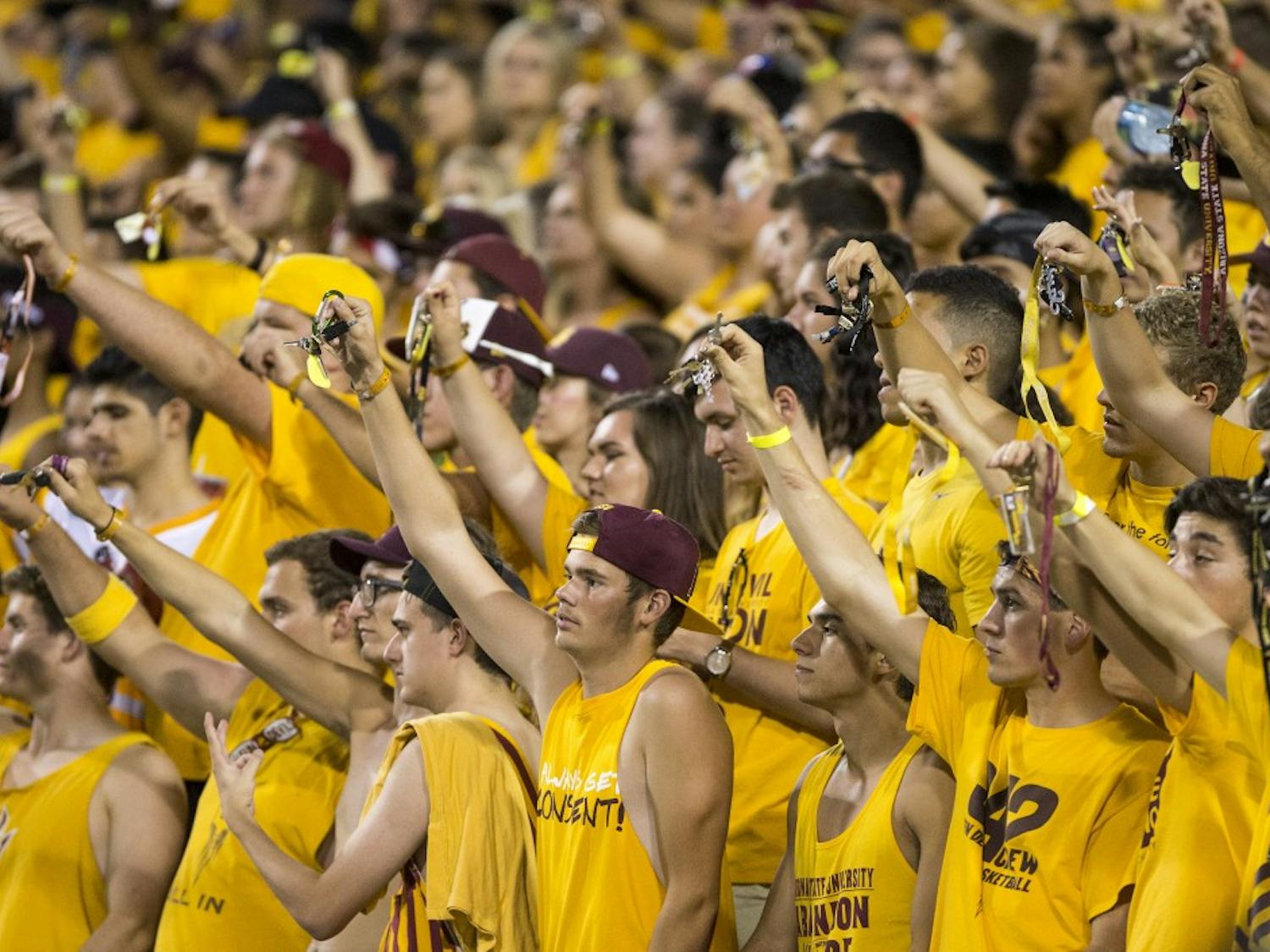 Students in the Inferno section wave their keys during a game against visiting Cal Poly at Sun Devil Stadium in Tempe on Saturday, Sept. 12, 2015. ASU beat Cal Poly 35-21 in their season opener. 