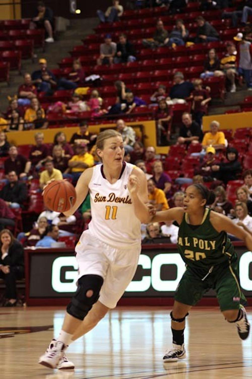 TOURNAMENT TRIUMPH: Redshirt junior forward/center Kali Bennett dribbles past Cal Poly redshirt senior guard Tamara Wells during ASU’s 69-58 victory on Friday. The Sun Devils also beat New Mexico on Saturday 55-40 to earn a sweep of the ASU Classic. (Photo by Rosie Gochnour)