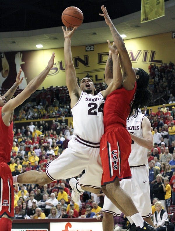 Trent Lockett attempts a shot against UA on Sunday. Lockett finished with 21 points, seven rebounds, five assists and four steals after the Sun Devils’ win against the Wildcats. (Photo by Sam Rosenbaum)