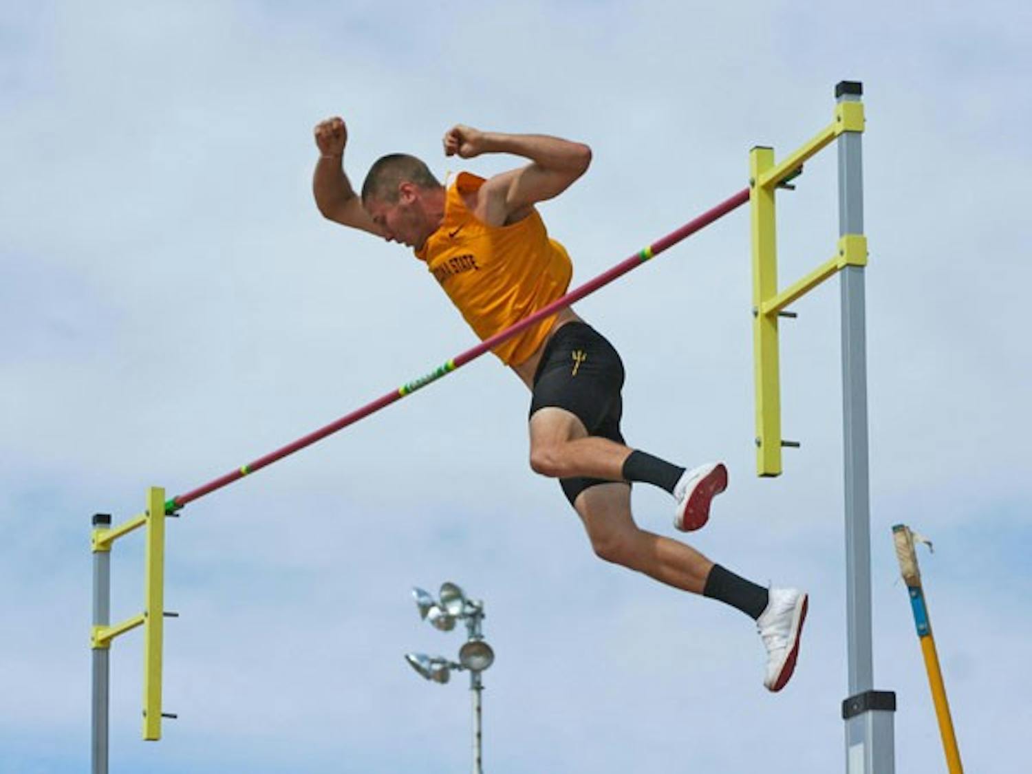 Final home meet: ASU sophomore Austin Prince stretches to clear the bar during the pole vault at the Sun Devil Open on Saturday. The Sun Devils close out the regular season with the Double Dual against both UA and NAU this weekend. 
