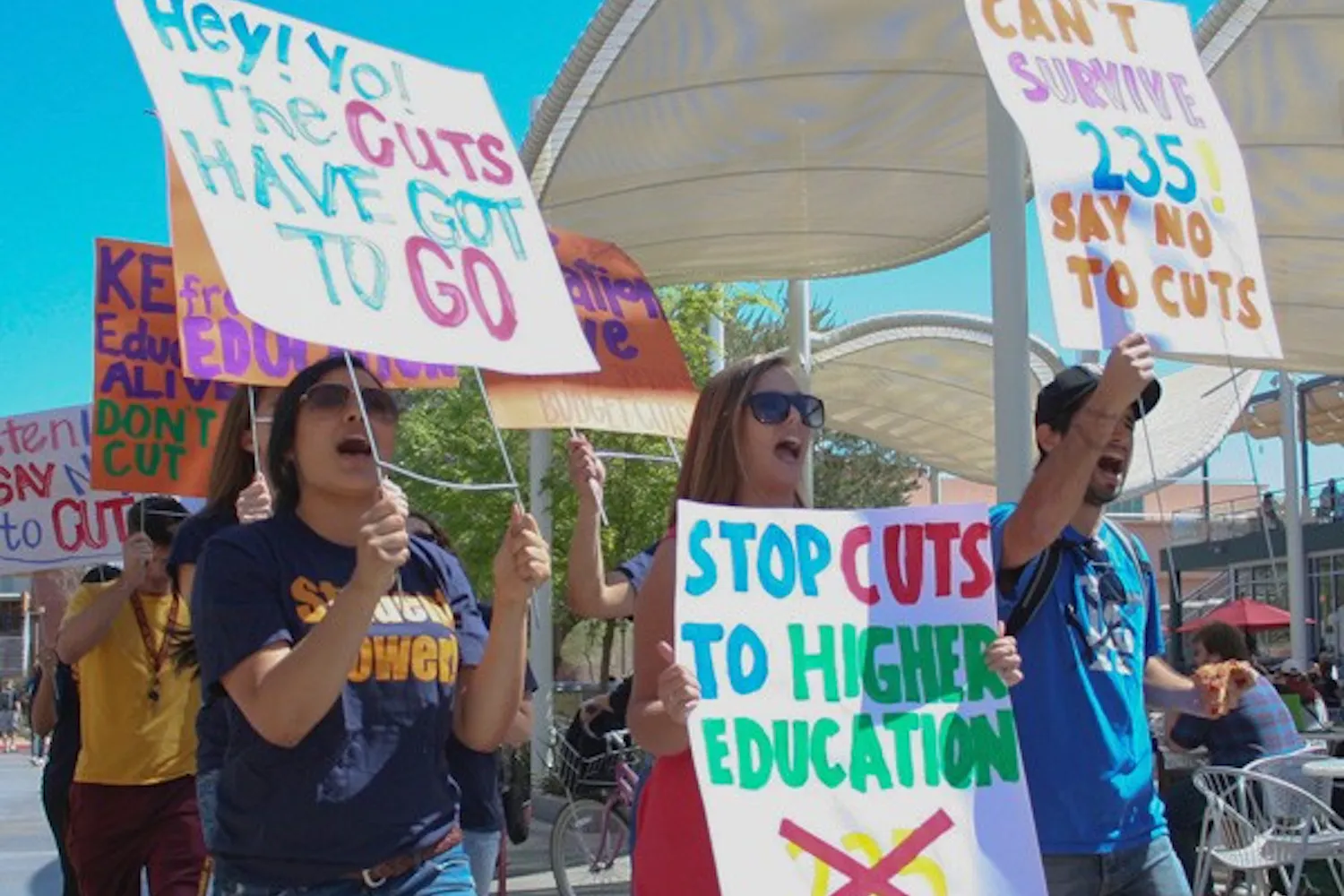 FIGHTING CUTS: Students rally against statewide education budget cuts outside of the Memorial Union on the Tempe campus Wednesday morning. A recently passed senate proposal could lead to a $235 million cut from the state university system, $100 million of which could affect ASU. (Photo by Lisa Bartoli)
