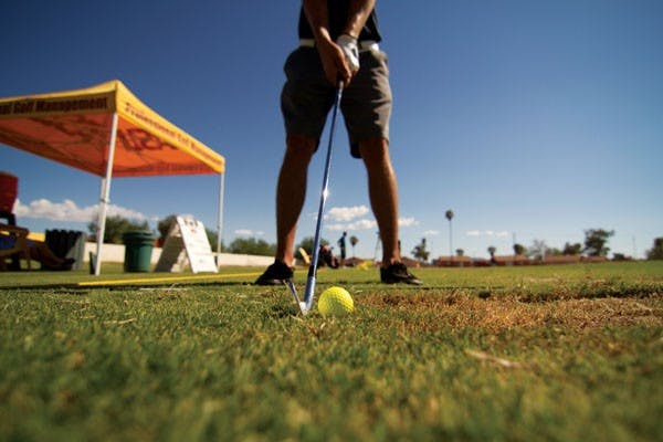 Senior professional golf management major Matt Jung works on his swing at the ASU Polytechnic Driving Range one late afternoon. (Photo by Vincent Dwyer)