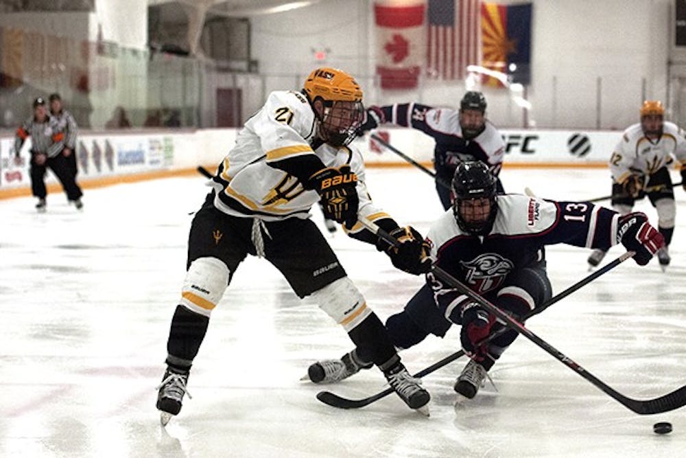 Forward Chris Burkemper takes a shot at the goal. ASU had a close match with Liberty University at Oceanside Arena on Thursday, Oct. 23, 2014. ASU won 6-4. (Photo by Mario Mendez)