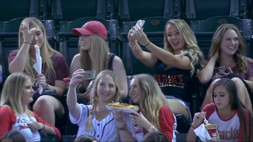 ASU students take photos at a recent Diamondbacks game. (Screenshot MLB.com)