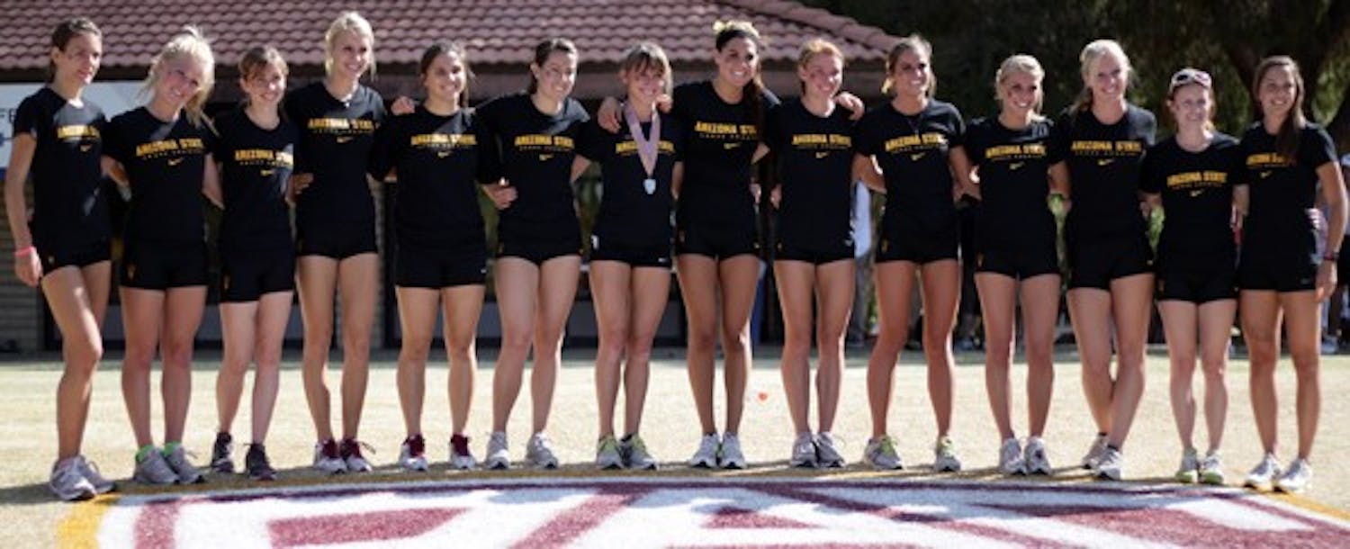 The ASU women’s cross-country team poses on the Pac-12 logo after the conference championships on Oct. 29. The Sun Devils are headed to the NCAA national meet after a solid showing at the West Regionals. (Photo by Beth Easterbrook)