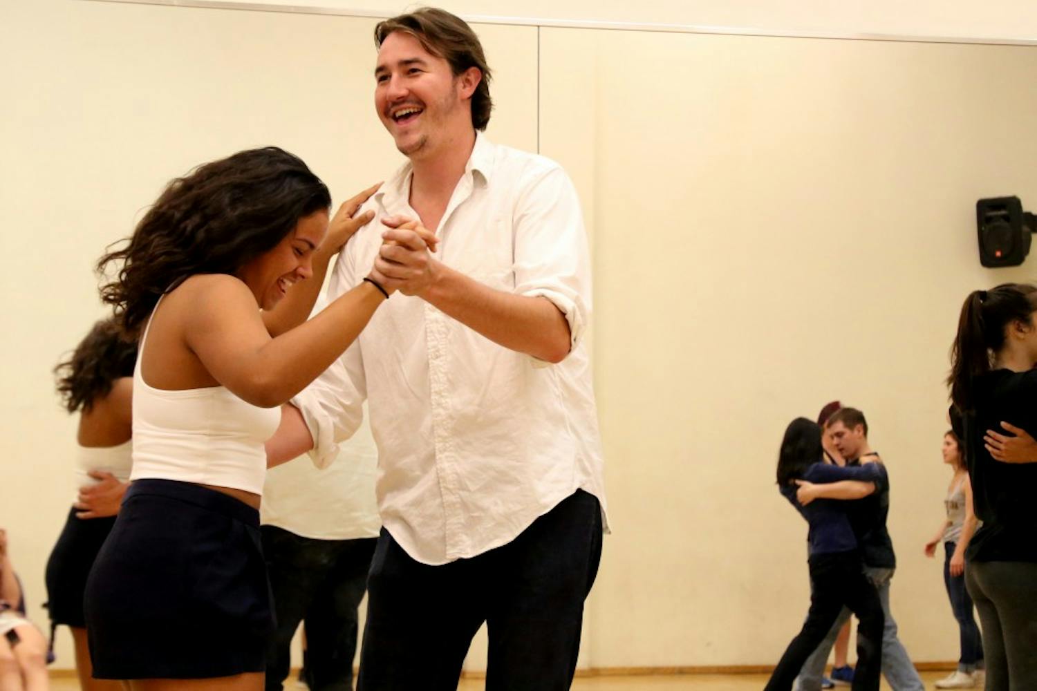Aerospace major Adrianna Conway, left, and Geoffrey Swanon, right, dance in Larry Caves' Lating/Swing/Ballroom I class on Tuesday, March 15, 2016, in the ASU Media and Performing Arts building on the Tempe campus. 