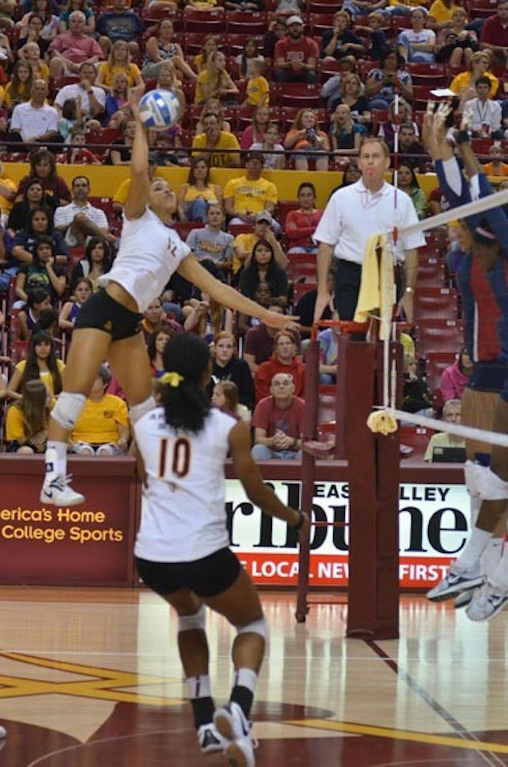 COMING DOWN: Senior outside hitter Sarah Reaves spikes a ball during a match earlier this season. With losses to UCLA and USC over the weekend, the ASU women's volleyball team was eliminated from postseason play. (Photo by Aaron Lavinsky)
