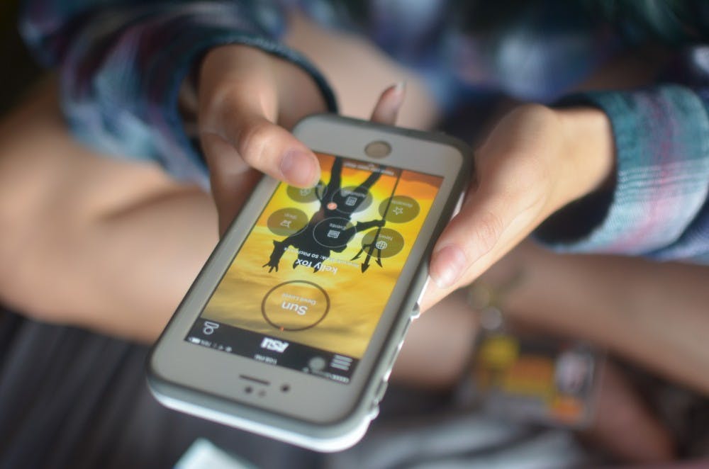 Freshman Kelly Fox with the Sun Devil Rewards app displayed on her phone. Pictured Sept. 15, 2016.