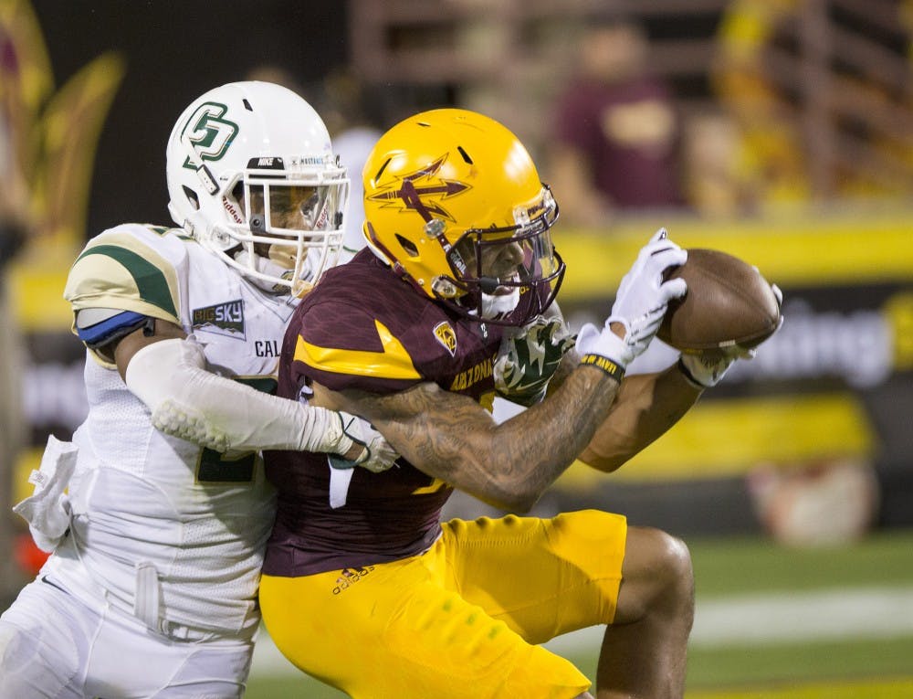 Wide receiver Devin Lucien snags a pass during a game against visiting Cal Poly at Sun Devil Stadium in Tempe on Saturday, Sept. 12, 2015. ASU beat Cal Poly 35-21 in their season opener. 